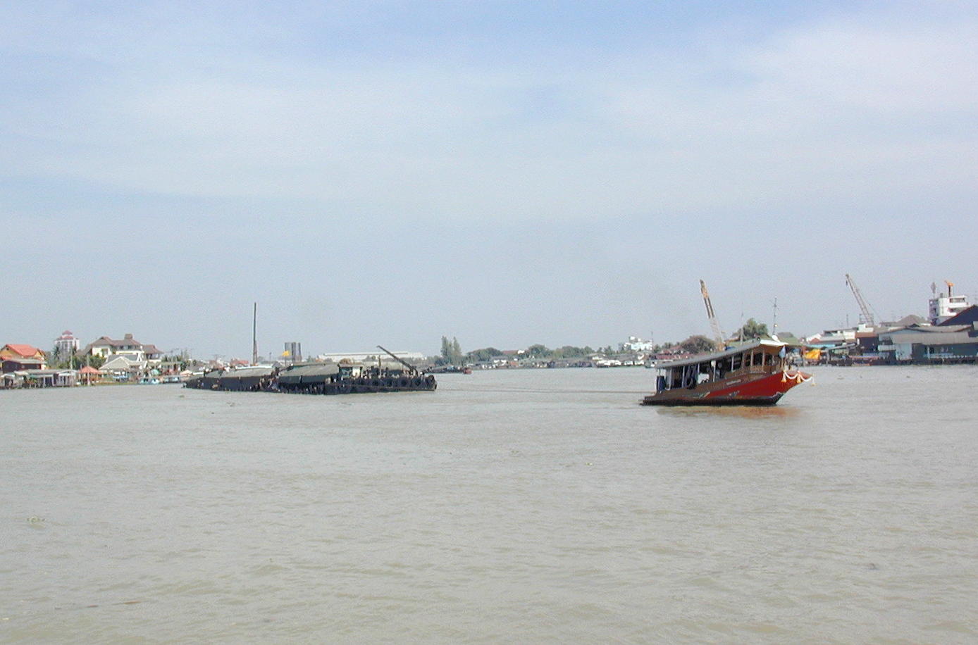 Tug pulls a barge